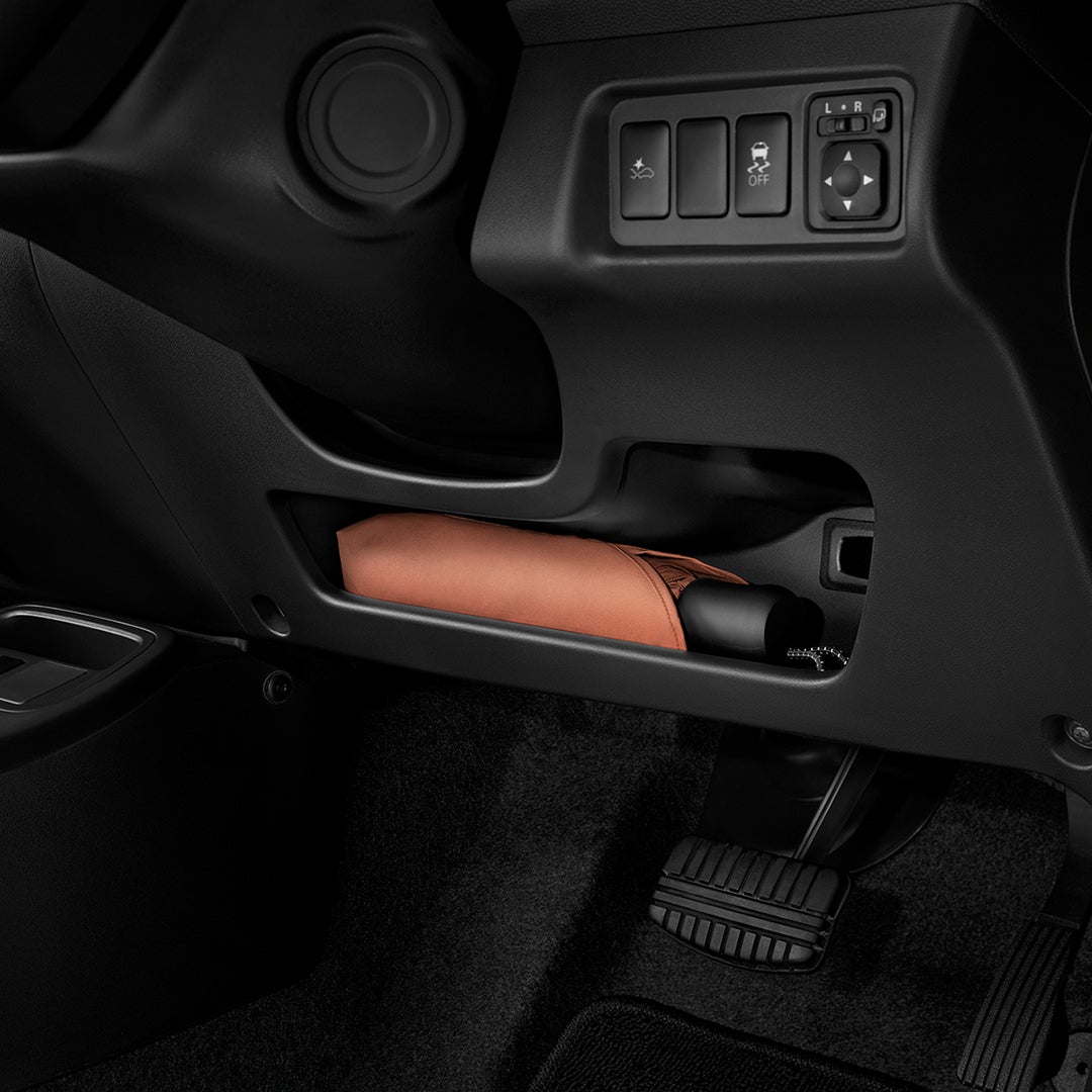 STORAGE UNDER STEERING COLUMN